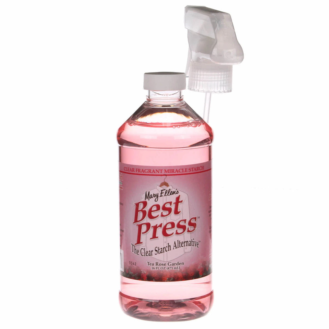 Bottle of Mary Ellen's Best Press with a pink label on a white background