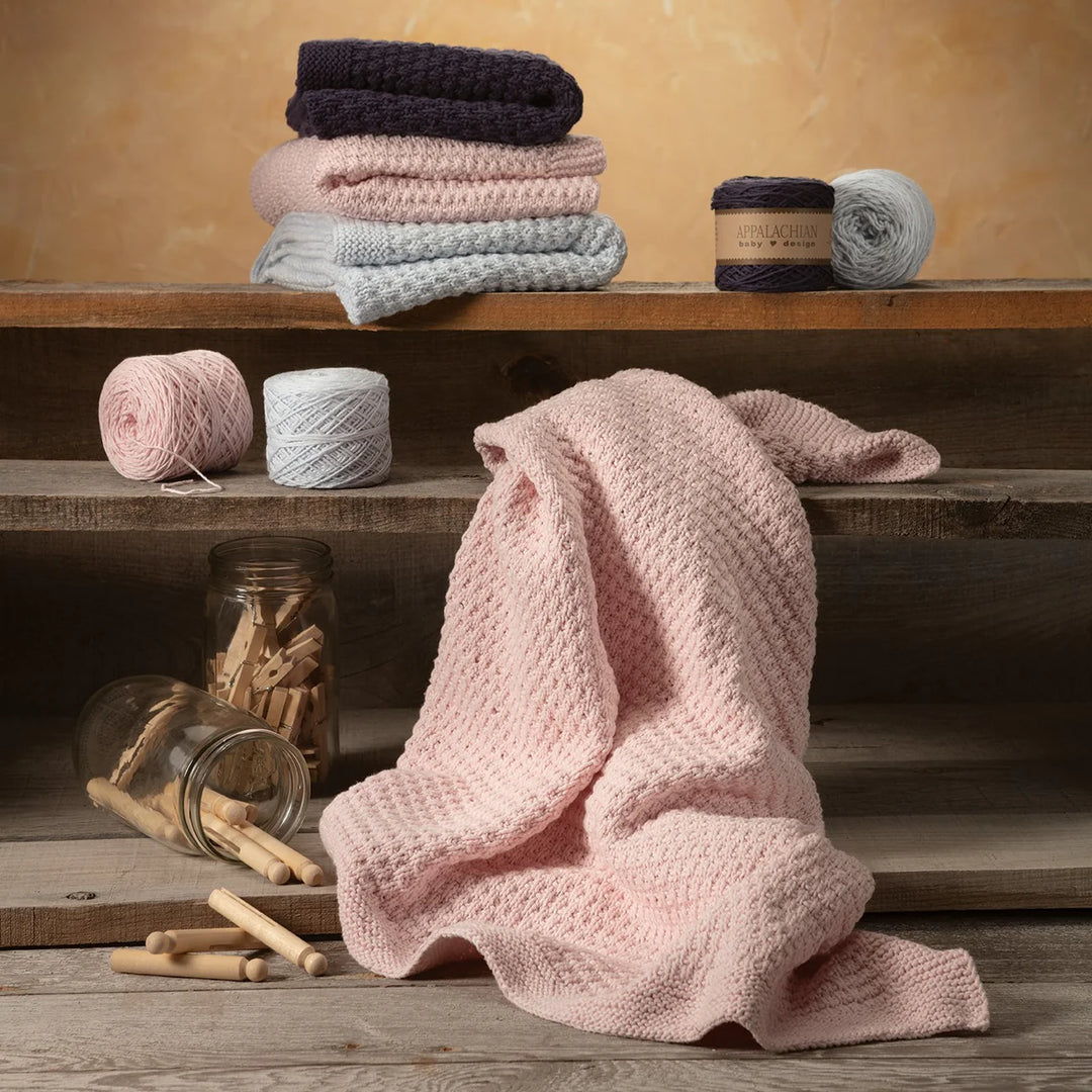 Sweet Dreams Knit Blanket samples shown with the matching yarn