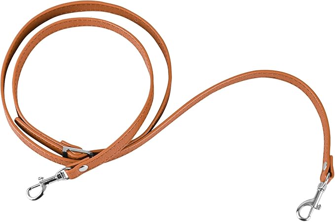 light brown leather purse strap with silver buckles on a white background