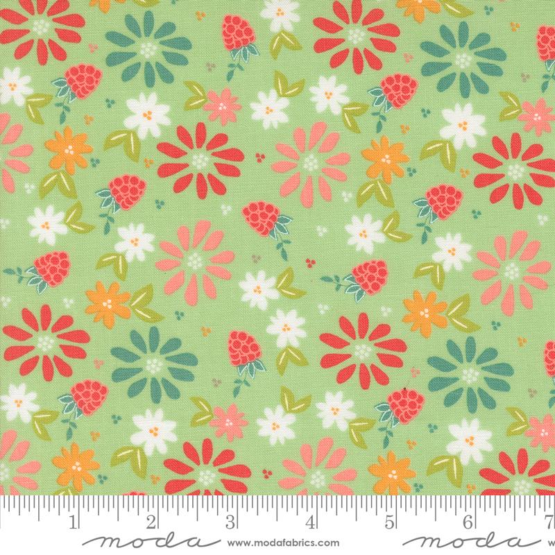 Green background with colorful spring flowers and red berries