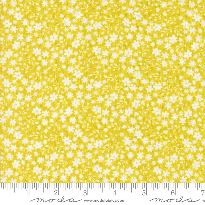 Yellow background with small white flower design