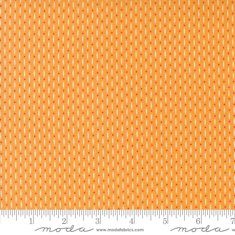 Orange fabric with lines and dots