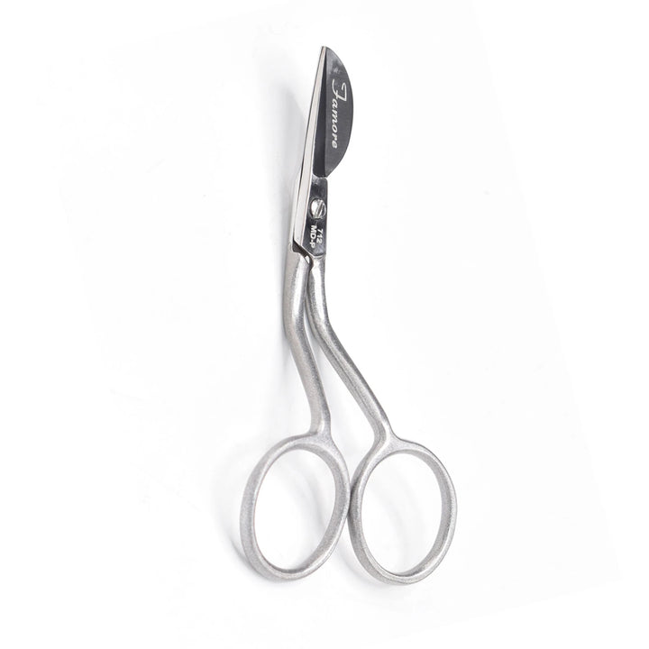 Pair of silver scissors on a white background