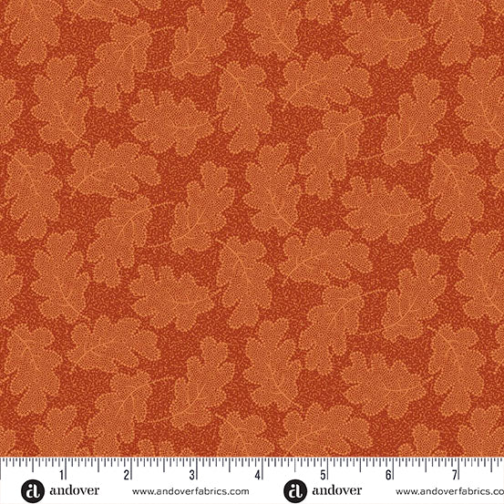 fabric swatch with a geometric pattern of light orange oak leaves on a slightly darker burnt orange textured background
