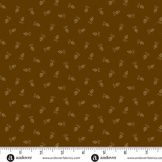 fabric swatch with a geometric print of small pine cone clusters in light brown all on a darker brown background