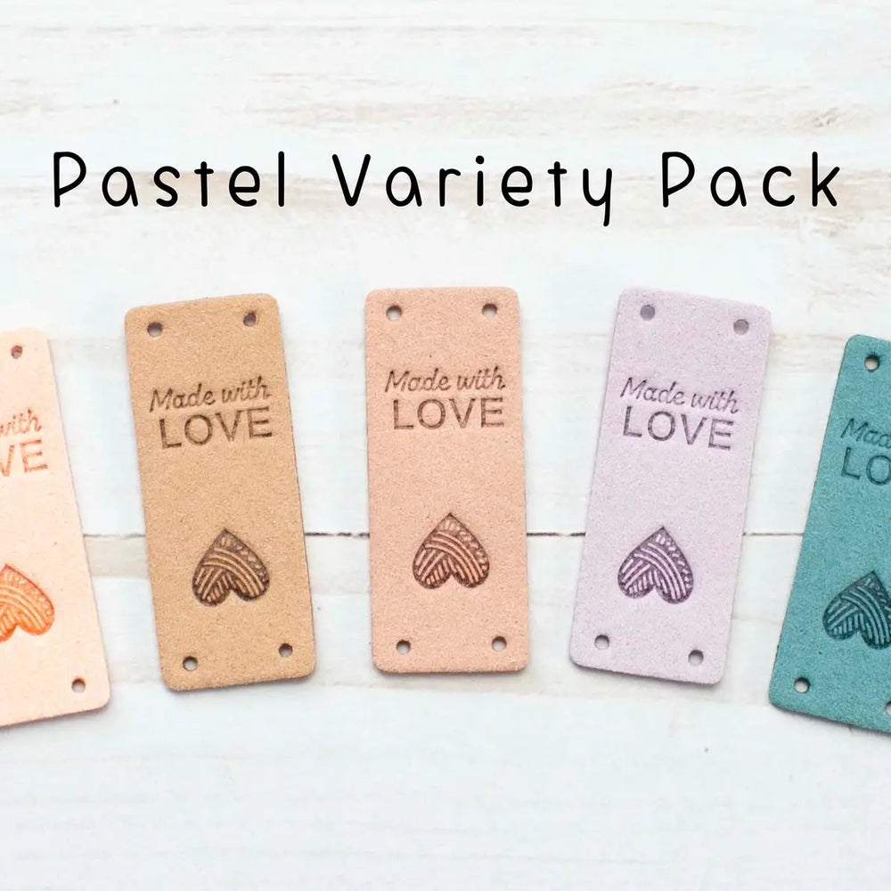 Pastel variety pack of 'Made with Love' tags on a light wooden surface.