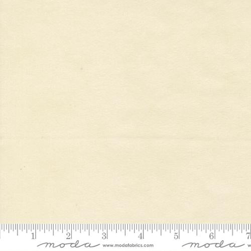 Beige fabric swatch with a ruler at the bottom for scale, featuring the Moda Fabrics logo.