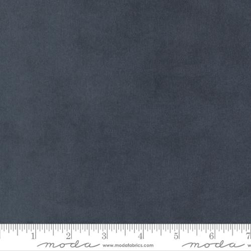 Solid dark blue fabric swatch with a ruler at the bottom