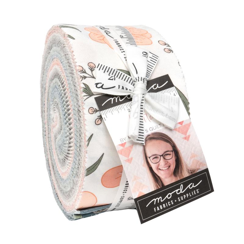 Roll of fabric with floral pattern and a label featuring a person's face, on a white background.