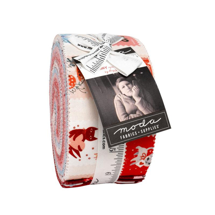 Roll of fabric with a pattern and Moda label on a white background