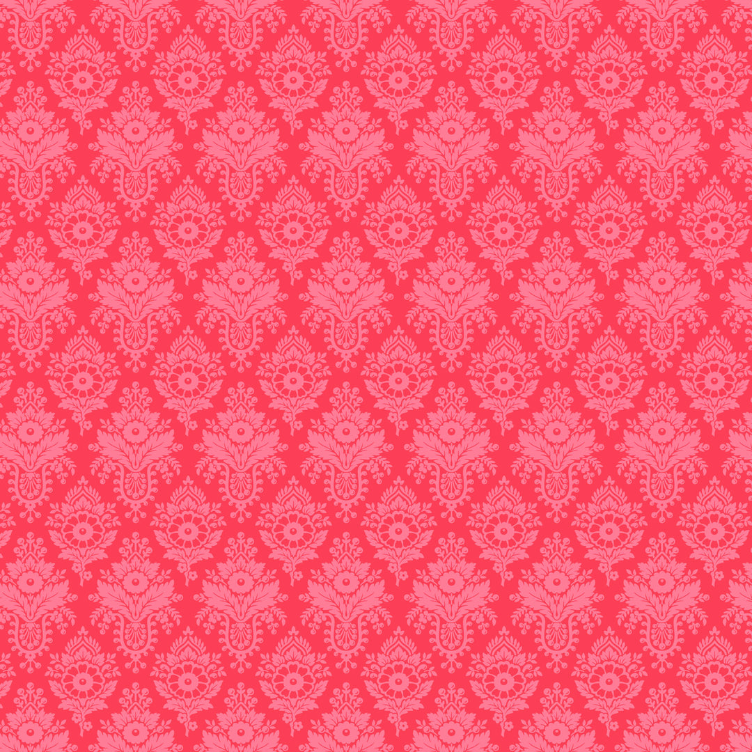 fabric swatch of pink florals arranged in a diamond geometric pattern on a bright coral background