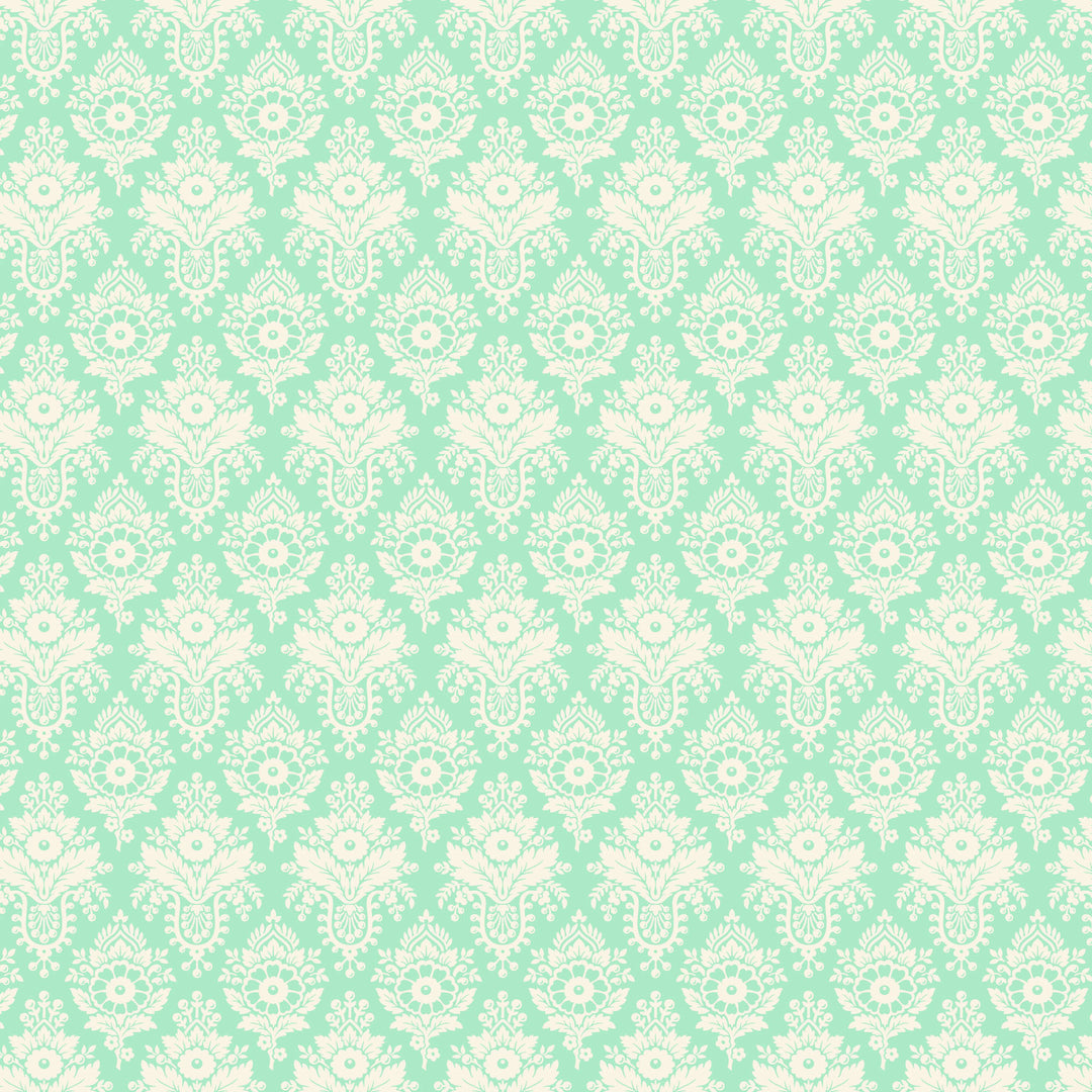 fabric swatch of white florals arranged in a diamond geometric pattern on a sea green background
