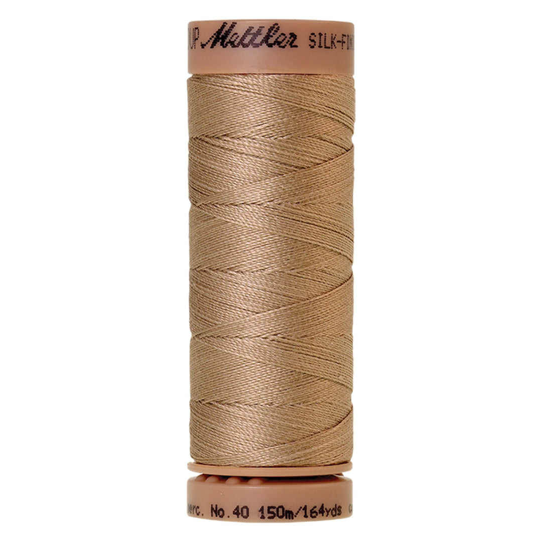 spool of Sandstone colored thread