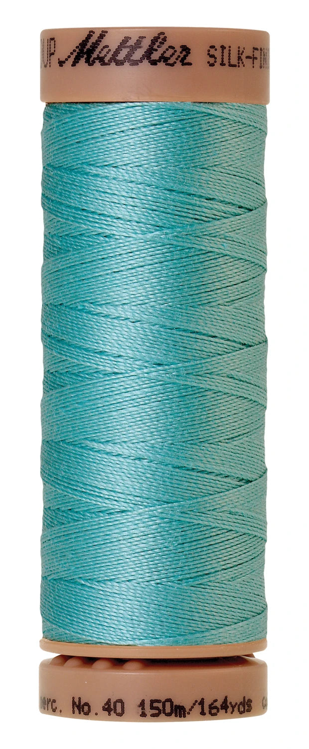 spool of Blue Curacao colored thread