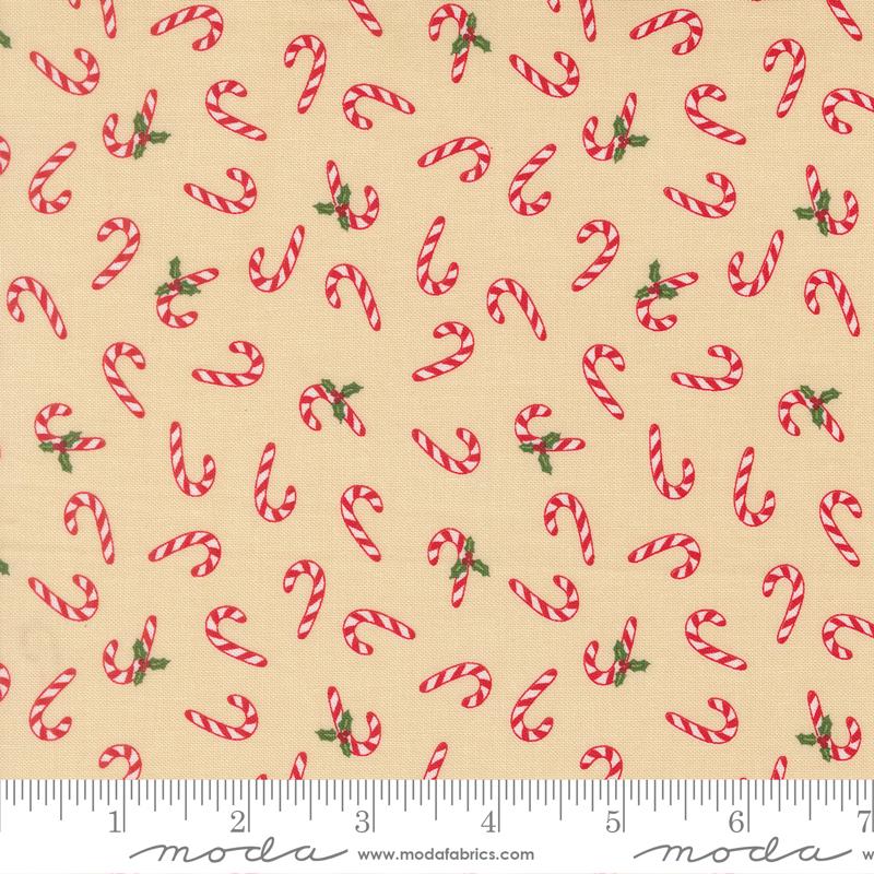 Pattern of red and white candy canes with green leaves on a beige background, featuring Moda label.