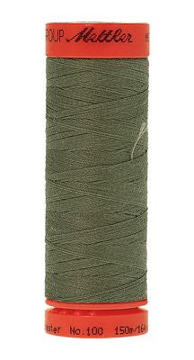 Green thread with a white background
