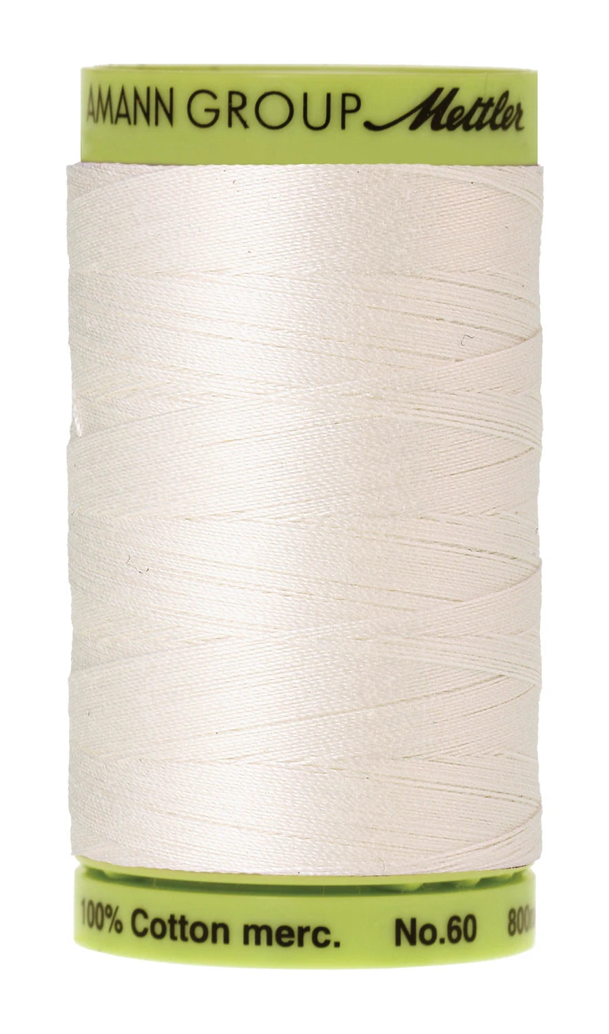 Spool of white thread with green label on a white background