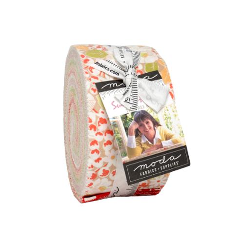 Roll of Summer's End strip fabric with a woman's face on the packaging against a white background