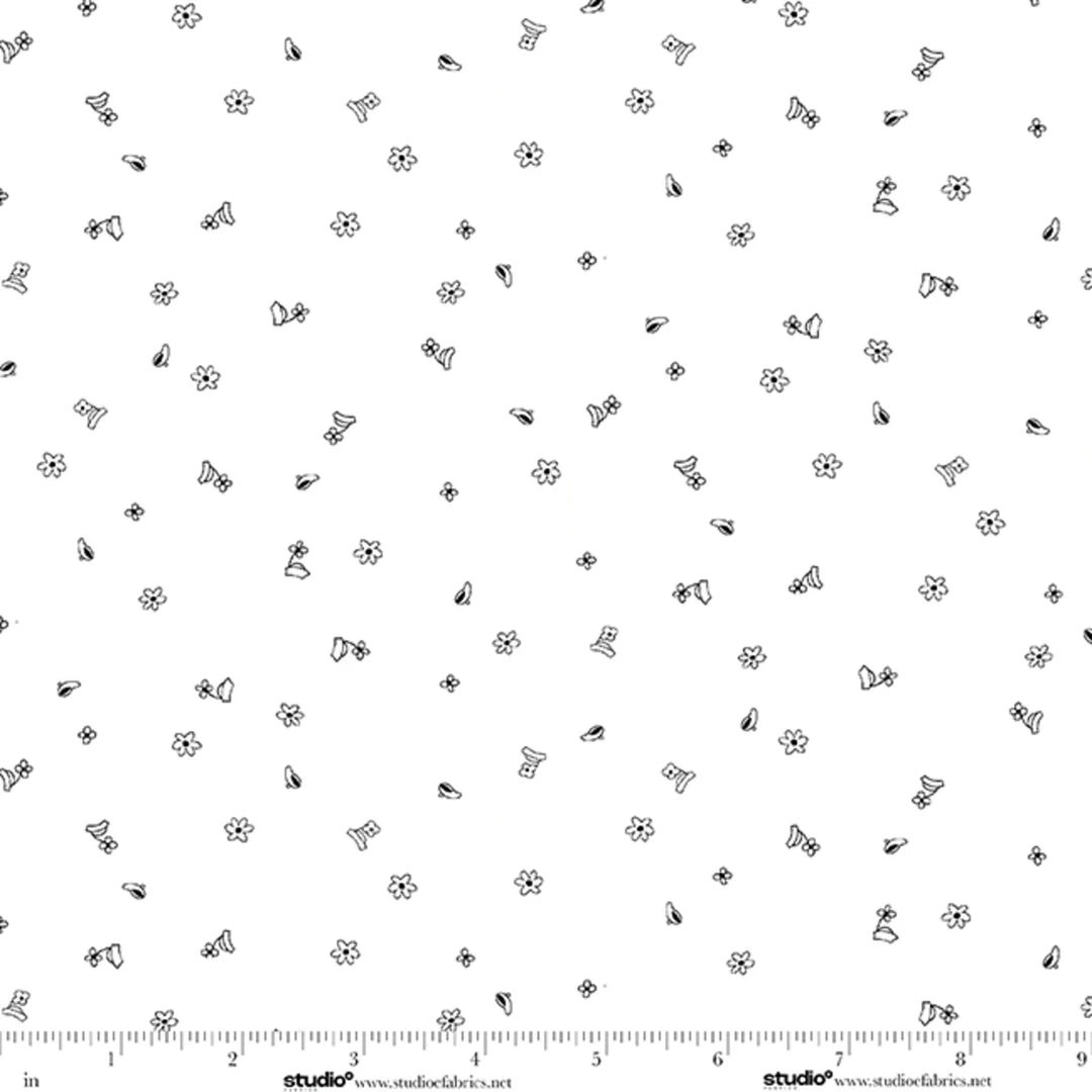 Black floral pattern on a white background with a ruler at the bottom.