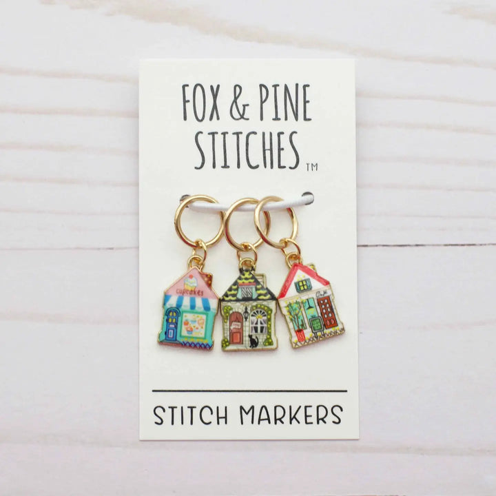 Three colorful stitch markers on a card with 'Fox & Pine Stitches' branding.