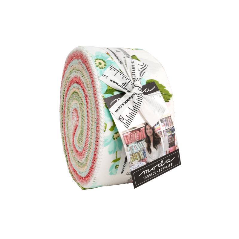 Roll of fabric with a colorful pattern and Moda label on a white background