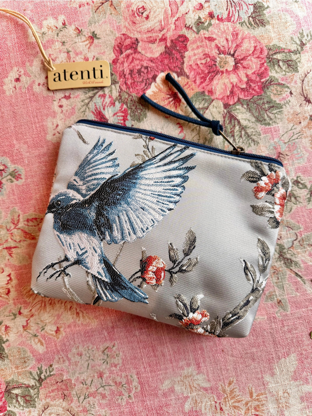 Fabric pouch with bird and floral design on a floral background, featuring the brand 'alenti'.