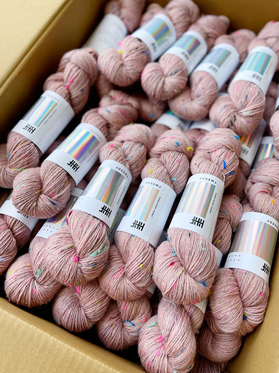 Light Pink Tweedy yarn with blue, orange, pink, and yellow