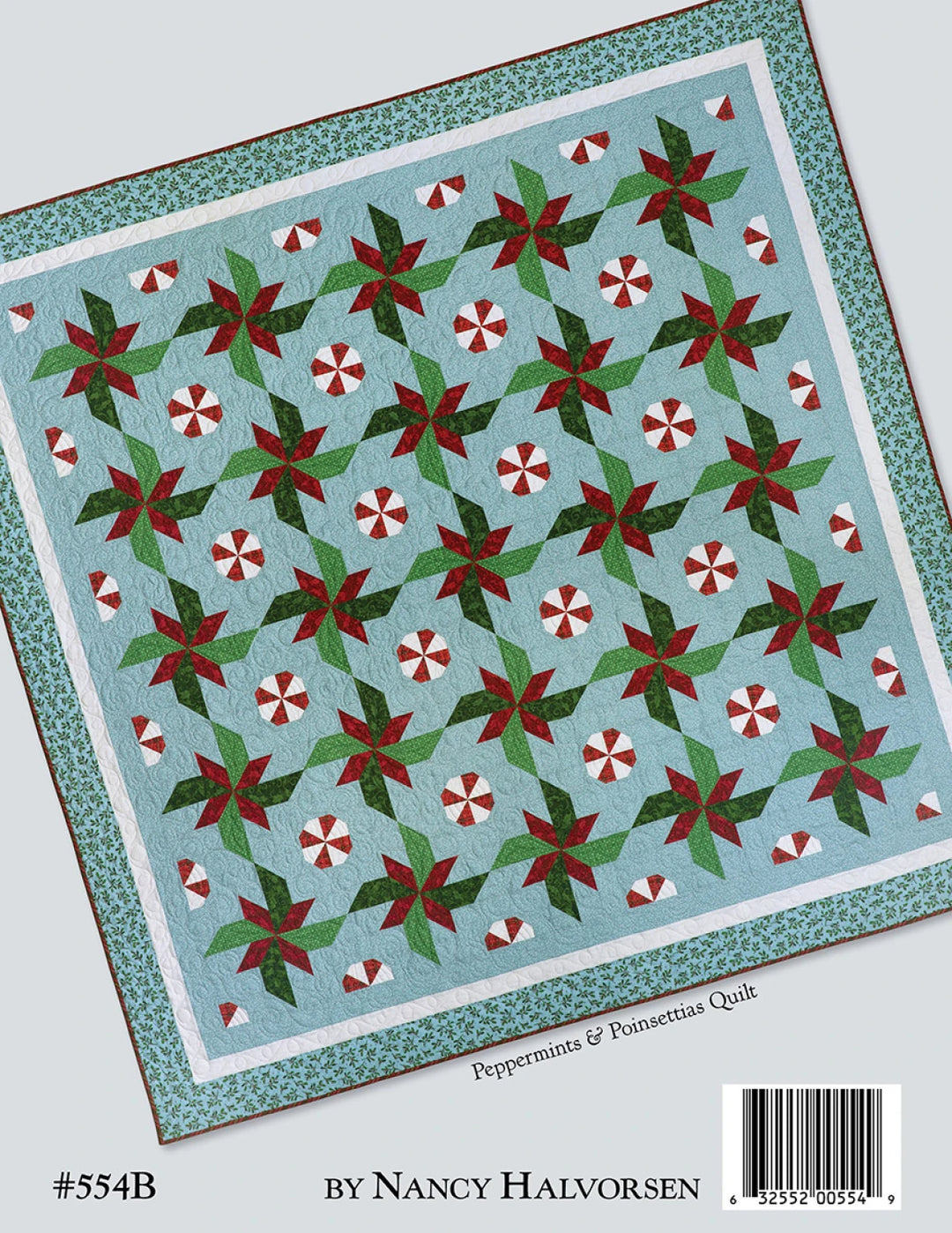 Quilt pattern with peppermint and poinsettia design on a blue background, by Nancy Halvorsen.
