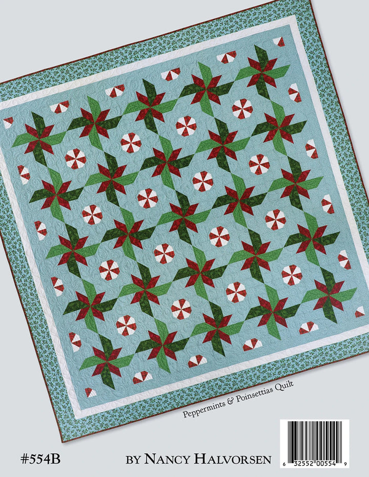 Quilt pattern with peppermint and poinsettia design on a blue background, by Nancy Halvorsen.