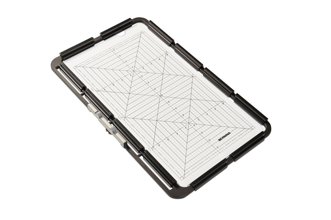 Grid embroidery hoop with black border on a white background