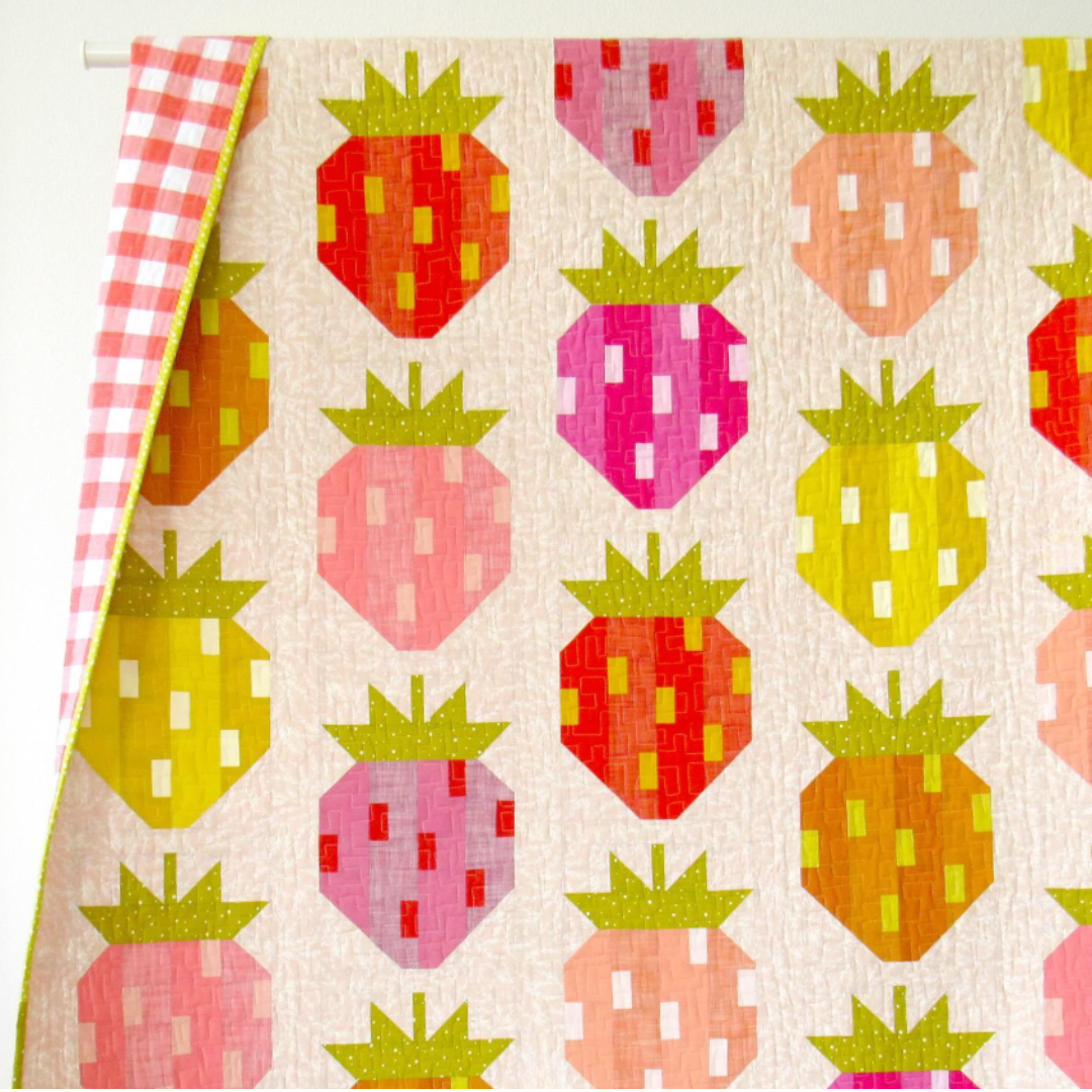 Fabric with colorful strawberry pattern on a beige background