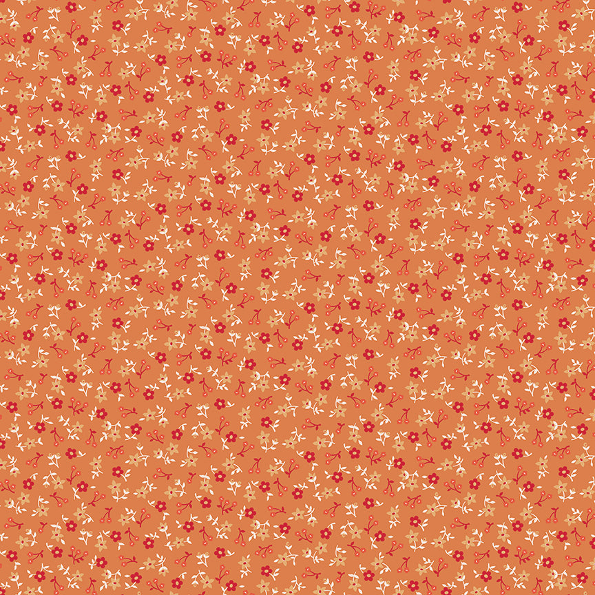 This print features tossed floral sprigs in orange