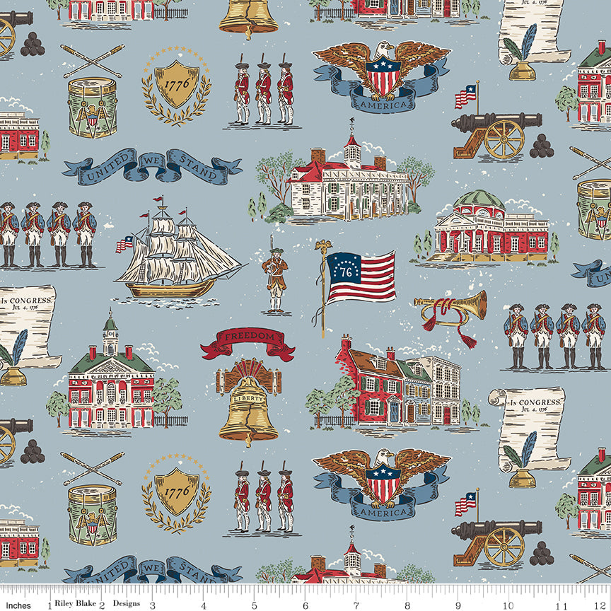 Fabric with historical-themed design featuring buildings, flags, and people on a blue background.