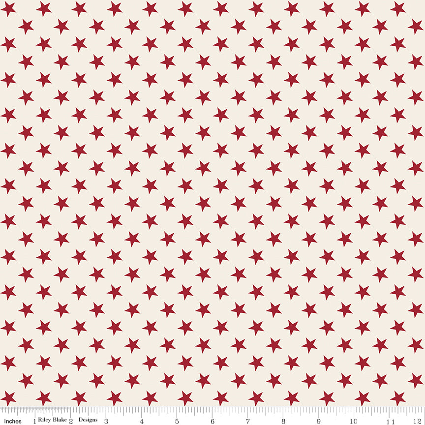 Pattern of red stars on a beige background with a ruler at the bottom.