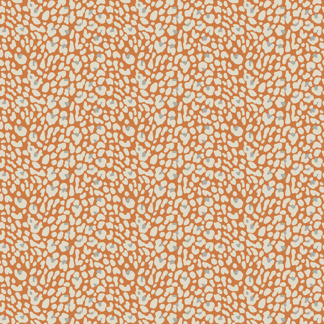 Patterned fabric with small white leopard print on an orange background