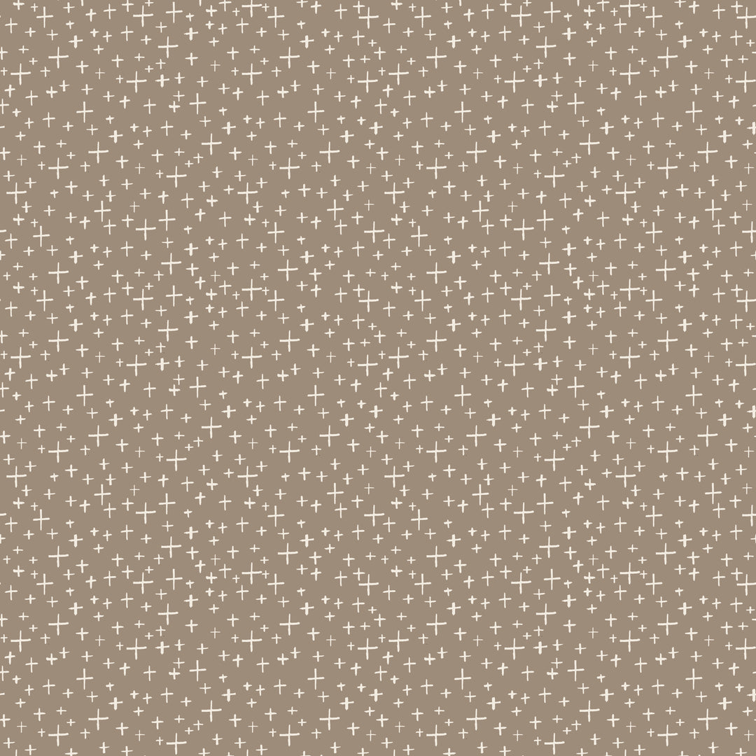Pattern of small crosses on a beige background