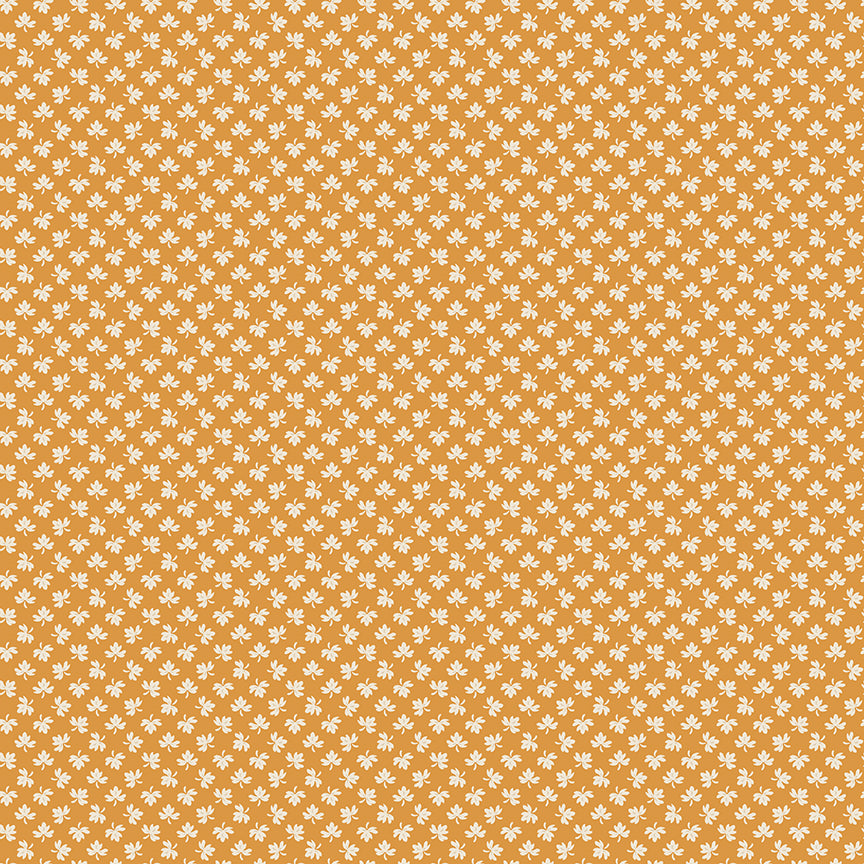 Pattern of small white flowers on a mustard yellow background