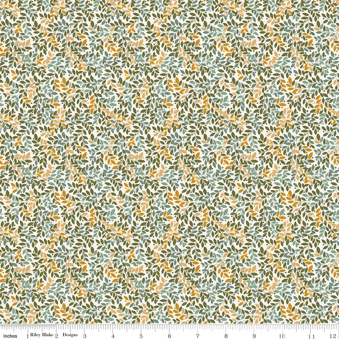 This print features small sprigs of green, blue and orange flowers and leaves on a warm white background. A white ruler strip appears along the bottom edge showing scale.