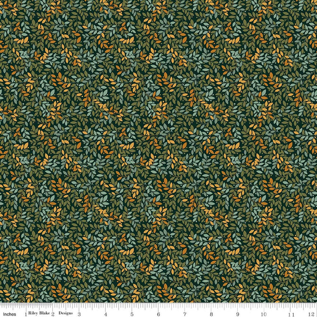 This print features small sprigs of green, blue and orange flowers and leaves on a warm white background. A white ruler strip appears along the bottom edge showing scale.