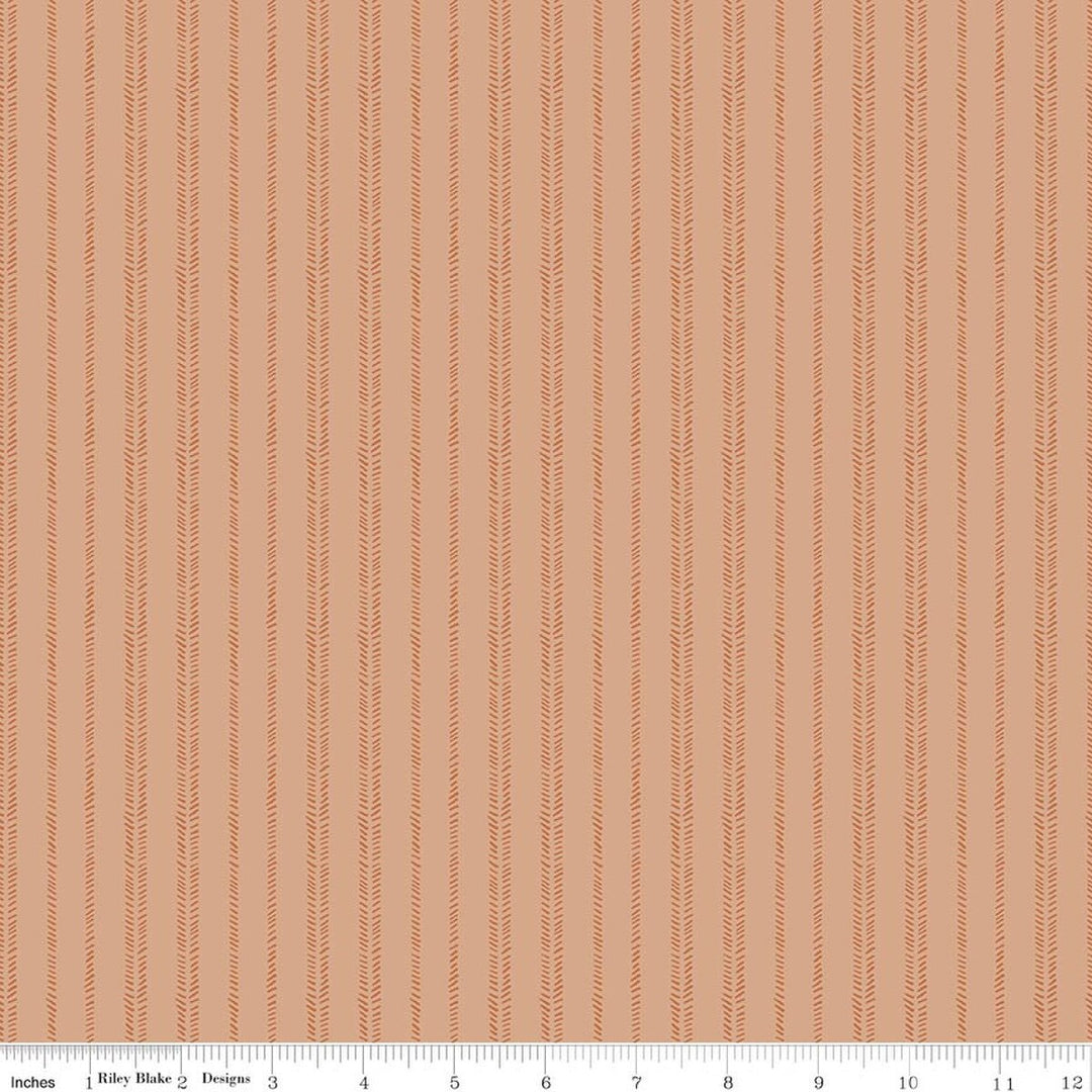 Blue fabric with geometric pattern, brand 'Riley Blake' visible