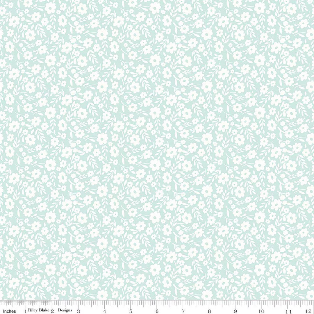 This print features a white sprigs of white flowers on a light aqua background.