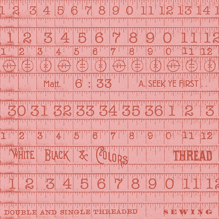 Pink sewing ruler with text and measurements on a red background