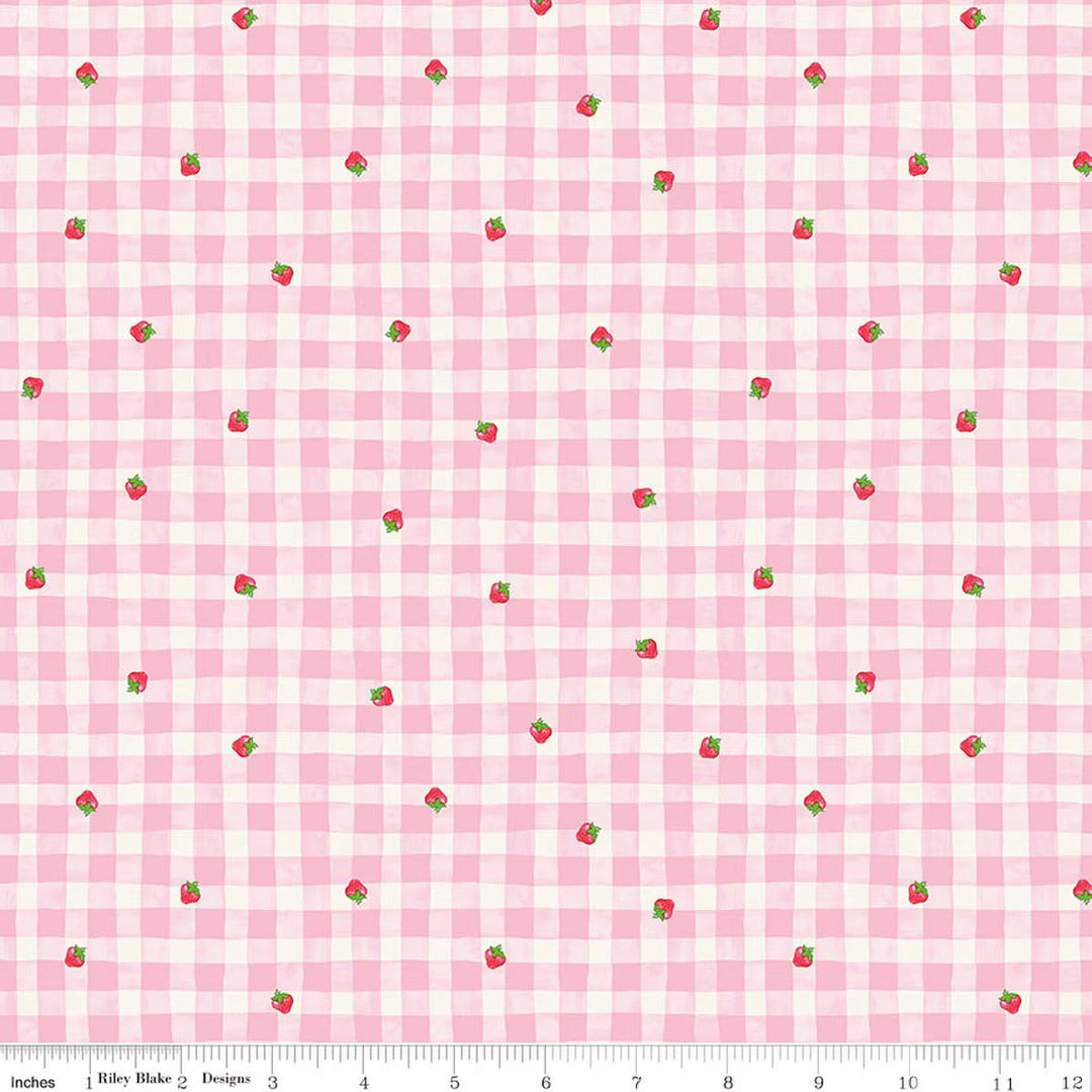 Pink and white checkered fabric with small red strawberries pattern