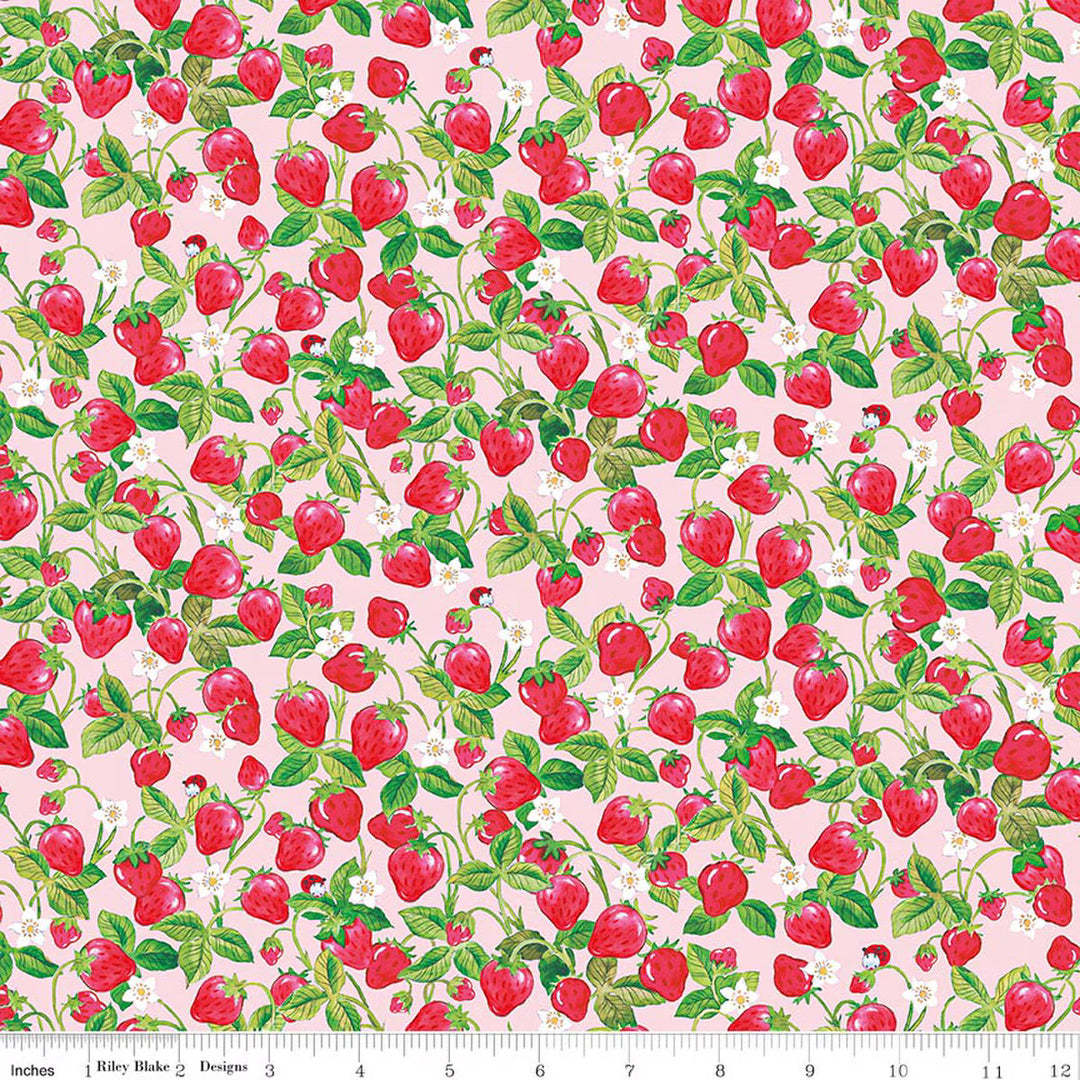 Pattern of red strawberries with green leaves on a pink background, featuring a ruler at the bottom.