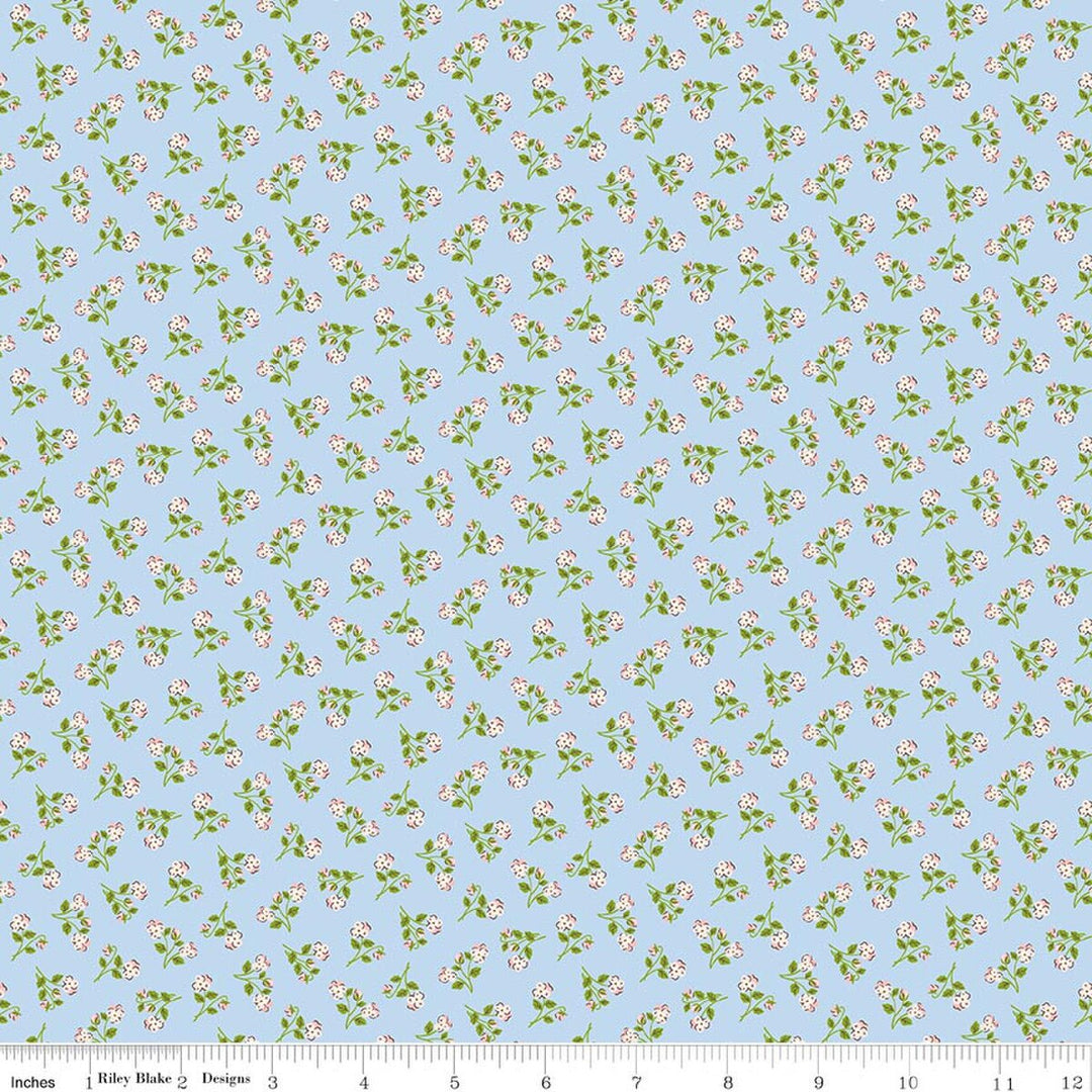 Floral pattern fabric swatch on a blue background