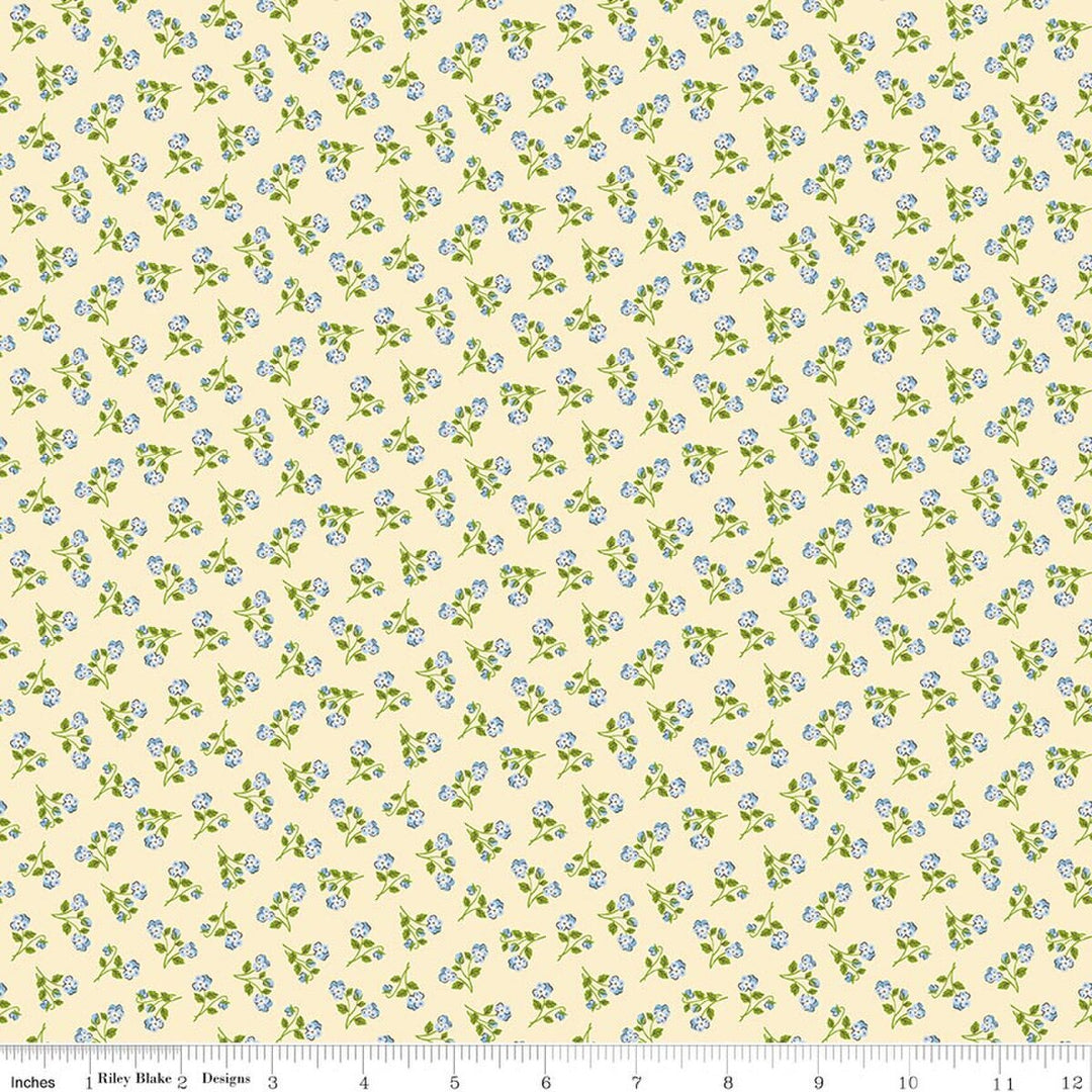Floral pattern fabric with small blue flowers on a beige background