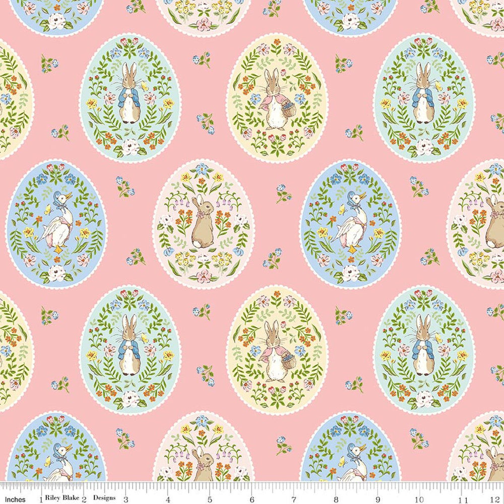 Patterned fabric with Easter eggs and bunnies on a pink background