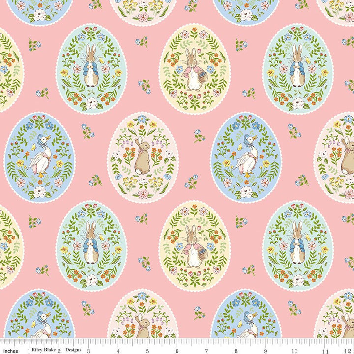 Patterned fabric with Easter eggs and bunnies on a pink background