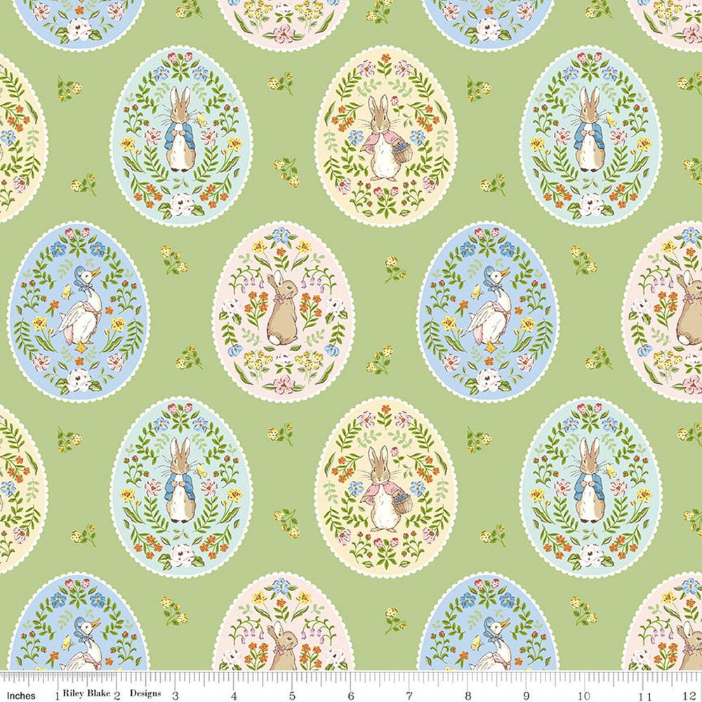 Patterned fabric with Easter-themed designs on a green background