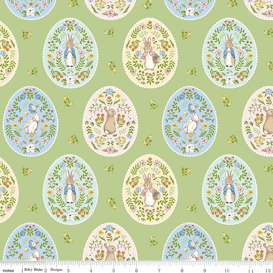 Patterned fabric with Easter-themed designs on a green background